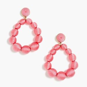 Round thread-wrapped statement earrings, pink